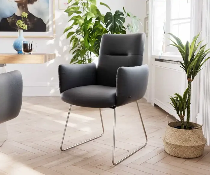 Esszimmerstuhl Jova-Flex mit Armlehnen Echt-Leder Schwarz Kufengestell Edelstahl Taschenfederkern