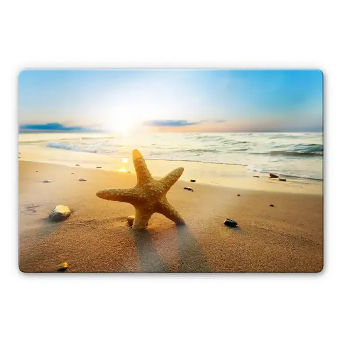 Glasbild Seestern im Sand